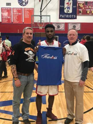 From last year's Silent Night game. From left to right: David Wihlborg, Nasir Dickerson (who hit the 8th point), and Dan Moylan (Lenape Valley Regional High School Boys Basketball Varsity Coach).
