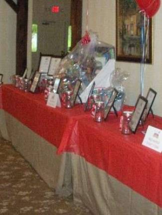 Golf outing raises money for education foundation Asampling of the dozens of Tricky Tray prizes donated by local businesses for the Andover Regional Education Foundation Golf Outing