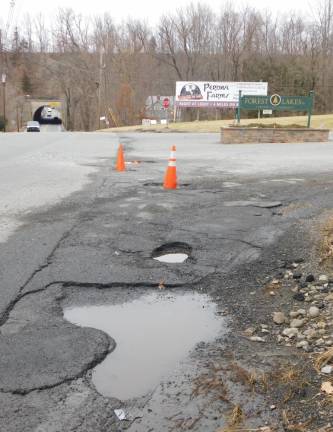 When is a road not a road? More questions than answers surface on Forest Lakes pothole Five potholes mar the entrance to Forest Lakes Drive North at Rt. 206 in Andover Borough on Monday Jan 13, 2020. Residents are concerned about the potholes, but have been unable to find a solution to having them repaired.