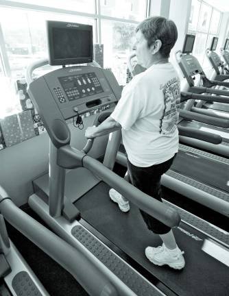 RDA Fitness serves community fitness needs Stanhope resident Debbie Solowey walks on one of the many treadmills at RDA Fitness.