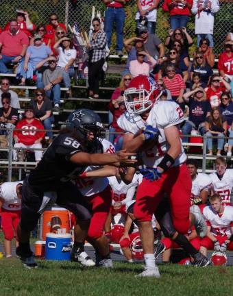 Lenape Valley smothers Wallkill in high school football A Wallkill Valley defender reaches for a Lenape Valley ball carrier.