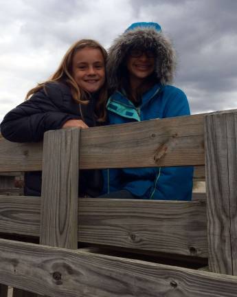 Apples, cider doughnuts and ice cream Ariana Begraft and Ashley Gordon board the ride out to Windy Brow's orchard