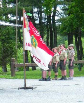 Music, fireworks and fun at Andover Township Day Scouts from Boy Scout Troop 85 of Andover and Newton salute as the flag is raised during the Opening Ceremony