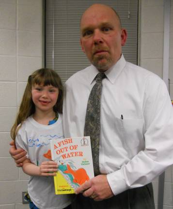 For the Love of Reading Photos By Amy STewart Amelia Van Luvender with Mayor James Oscovitch at the Love of Reading celebration, where the students read "A Fish Out of Water" by Helen Palmer.