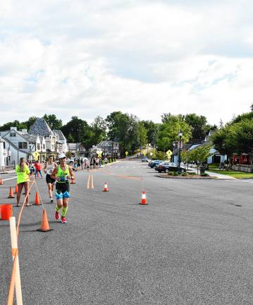 Photos: Pass it Along’s 14th annual Triathlon The running section goes along the eastern shore of Lake Mohawk and ends at White Deer Plaza.