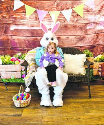 Tenley Crane of Vernon sits on the Easter Bunny’s lap at the breakfast hosted by Branchville Hose Company #1 on Sunday, March 3. (Photo by Maria Kovic).