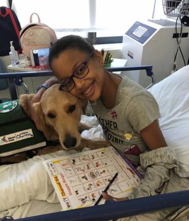 Providing Some Fun in a Child’s Hospital Stay Patient Kayla with Professor. (Photo: Mount Sinai Kravis Children’s Hospital)
