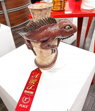 Annalyse Tattoli wins second place for her sculpture titled ‘Iguanas Embrace.’