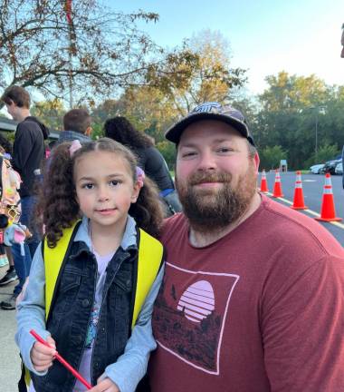 Kindergartner Violet Eigenrauch poses with her father, Nathan. (Photo by Nick Lalama)