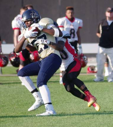 Sussex Stags lose season opener After catching the ball Sussex Stags wide receiver Tahke Martin holds on to it while being tackled.