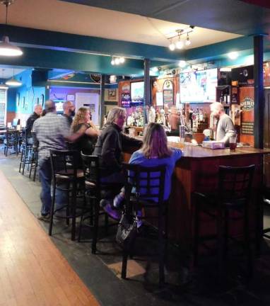 Patrons enjoy the bar's Happy Hours. Photos by Mandy Coriston