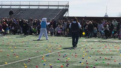 Children begin the Easter Egg Hunt on Saturday morning, April 8 on the turf field at Newton High School. (Photos by Kathy Shwiff)