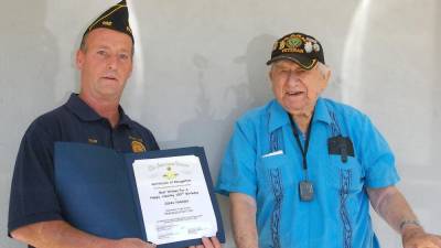Post Commander Rob Lawler (left) presents former Post Commander and World War II veteran John Yanish with one of several certificates acknowledging his service to his country and community. (Photo by Chris Wyman)