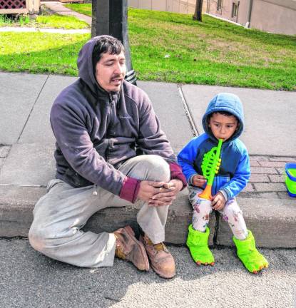 Alex and Samuel Castellna wait for the parade.