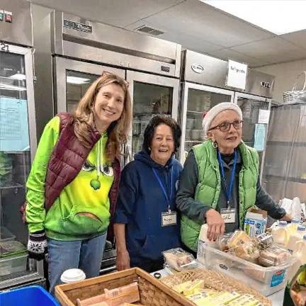 Community food pantry turns 40 FP3 Volunteers Sue Duffy, Margy Laplace and Gail Pelli package holiday meals in 2023. (File photo)