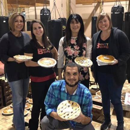 From left to right Kelly Noguerol, Heather Davey, Terri Dicks, Casey Sutton and Ben Davey (in front) from the Thanksgiving Pie Drive.