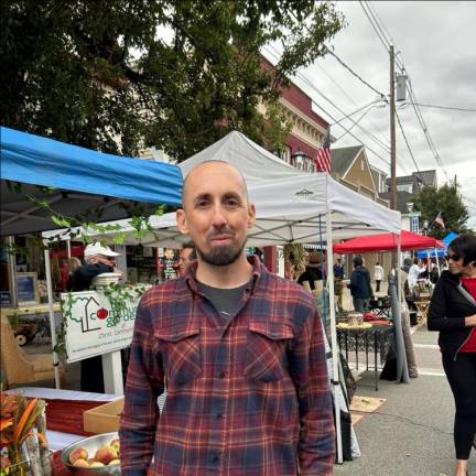 Pastor Sean Muldowney of Christ Community Church in Newton was handing out free pizza.