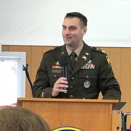 Veterans honored with parade, ceremony U.S. Army Capt. Robert ‘Bo’ Farrell of Hamburg speaks during a ceremony in the Richards Building at the fairgrounds.