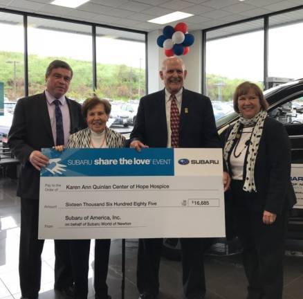 Subaru helps drive Quinlan Hospice into its 40th year From left to right: John Quinlan, Julia Quinlan, Chris Dexter, and Marlina Schetting as Dexter presents the check to Co-Founder and CEO, Julia Quinlan. (Photos by Laurie Gordon)