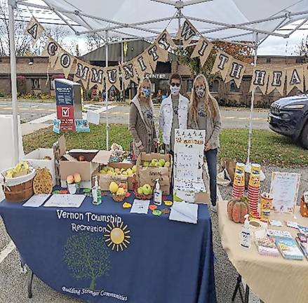 The Vernon Township Recreation Dept. displays information and fruit at the vernon Township Farmers' Market. (Photo courtesy Howard Burrell)