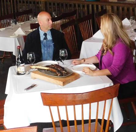 Mohawk House owner Steve Scro and Restaurant Hunter NJ host Christine Sloan sit down for a chat over a Pat LaFrieda steak in the restaurant’s conservatory on Thursday, Aug 15, 2019.