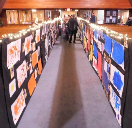 Preschoolers show off their art skills in annual gala Artwork inspired by the storybook Mix It Up lines the aisle of the Lutheran Church of Our Savior during the Our Savior Nursery School art gala on Thursday, Feb 27, 2020. This work was created by the school's 3s Class for the event.