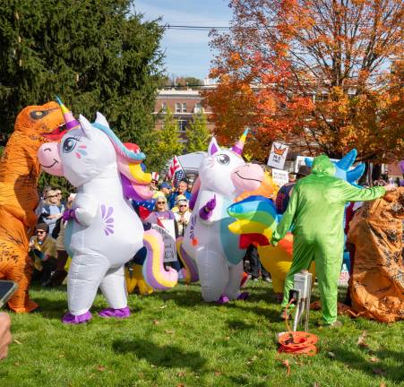 ’No Kings’ rally draws estimated 600 people to Newton People in costumes dancing.