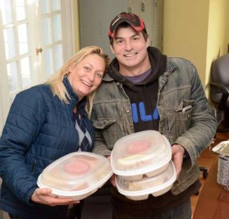 Local merchants, volunteers give back for Thanksgiving Teresa Selinger and Bruce Lemler from ARTwood.
