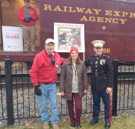 Toy Train makes Sparta stop From left, John Sobotka of Toys for Tots, Katelyn Leondi of Train Creative and Major Chris Bolidura of the U.S. Marine Corps.