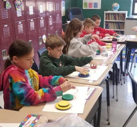 Student Math sure adds up Students practice their math activities presented by Steve and/or Vicki Megna from the Young Consumer Program with ShopRite.