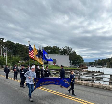 Members of the Ogdensburg Fire Department march in the parade.