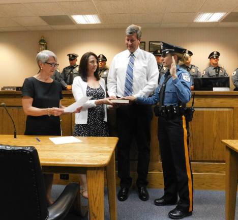 Julia Perry is sworn in as Andover Township&#x2019;s first female police officer by Mayor Dolores Blackburn on Thursday, June 6, 2019. Holding the bible are Perry&#x2019;s parents, Jennifer and Greg Lwowski. (Photos by Mandy Coriston)