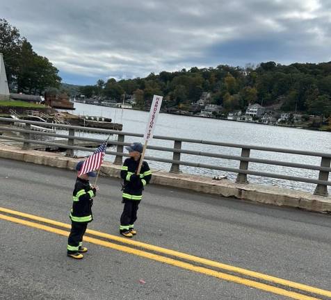 Two boys dressed as firefighters precede members from the Hardyston Township Volunteer Fire Department in the 103rd annual Sussex County Fireman’s Association Inspection Day &amp; Parade.