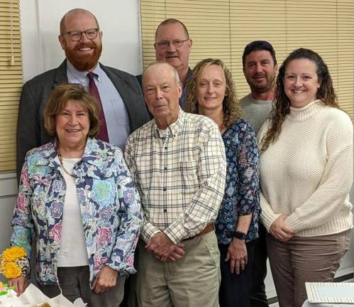 JoAnne Daniels, front left, poses with county officials at her retirement party April 24.