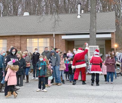 ‘Ye shall find the babe wrapped in swaddling clothes, lying in a manger’ Santa also paid a visit to the manger and the youngsters (Photo courtesy of Father Julio)