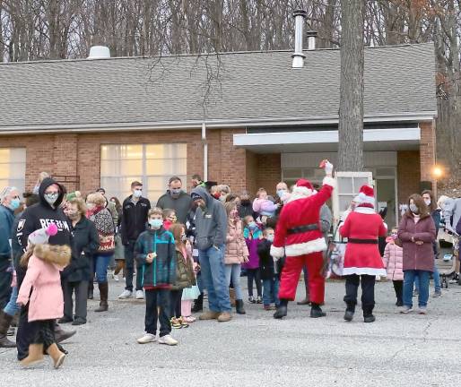 Santa also paid a visit to the manger and the youngsters (Photo courtesy of Father Julio)