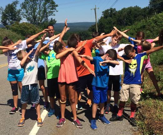 Local running phenom returns to camp that inspired him A "dab" on Fredon Hill after the kids ran to the top, at last year's camp Photo by lauried Gordon