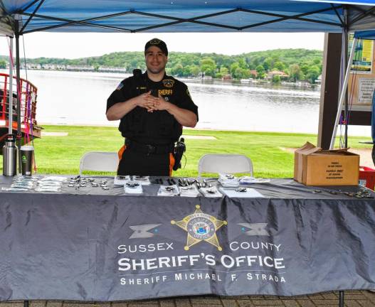 Photos: Lake Hopatcong Block Party LH1 Nicholas Galvao mans the table for the Sussex County Sheriff’s Office at the Lake Hopatcong Block Party on Saturday, May 18. (Photos by Maria Kovic)