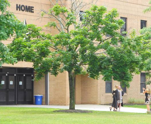 ‘All eyes are on the Class of 2020’ Students take one last picture in front of Wallkill Valley Regional High School. (Photo by Vera Olinsky)