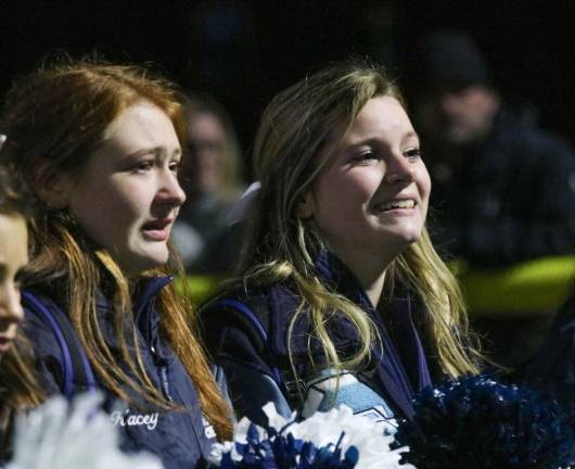 It starts to dawn on the cheer team that this may be the final game of the season.