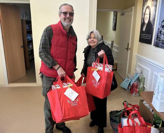 Project Self-Sufficiency seeking donations for seniors <b>Alice and Kevin Prendergast assemble gift bags for local senior citizens as part of Project Self-Sufficiency’s Earth Angels initiative.</b>