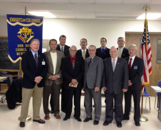Knights of Columbus welcome new members Left to Right, first Row: Bob Tiscornia, Grand Knight, Don Bosco Council, Jean Claude Marlin, John Antanies, Anthony Caroleo, Edgar Luna, and Mike O'Malley, Grand Knight, Marquette Council. Second Row: Rich Fuchs, James P Quinn, James P Quinn III, and David Stock.