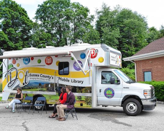New mobile library launched <b>From left are Julie Knapp, public information officer of the Sussex County Library System, and Commissioners Dawn Fantasia and Jack DeGroot at a ceremony to launch the new mobile library.</b>