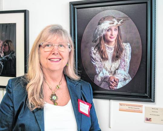 Bonnie McCaffery wins in the People/Pets Category for ‘Girl in a Hat.’