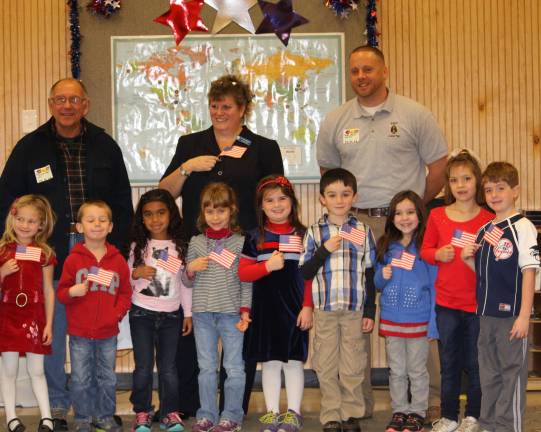 Camp Auxilium honors veterans Kindergarten class with veterans.
