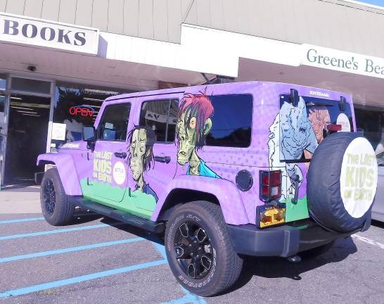 Kids 'touch zombies' and play Mad Libs with author Max Ballier at Sparta Books 4- Big Mama, a character: in the popular Last Kids on Earth book series, is parked outside of Sparta Books on Tuesday, Sept. 17, 2019, as her creator, author Max Brallier visits with young fans at Sparta Books.