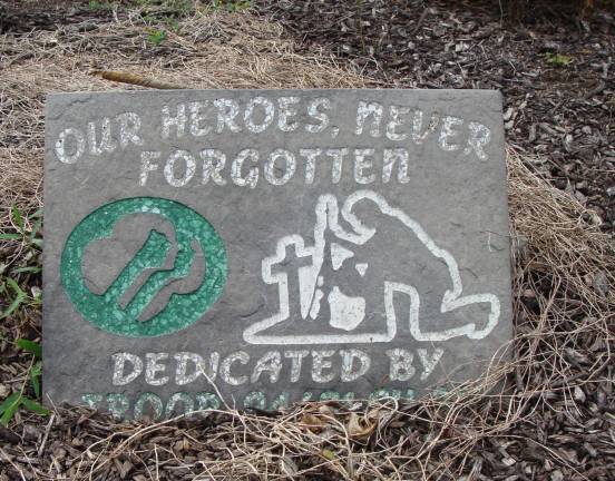 A remembrance from a scout troop honors veterans at the cemetery