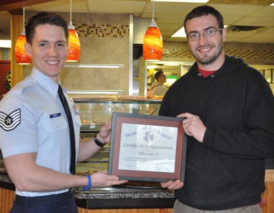 U.S. Air Force honors local business Jennifer Jean Miller U.S. Air Force Technical Sgt. Ryan Smith presented Villa Capri II manager Pete Bovee.
