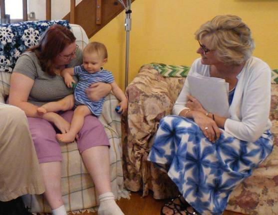 Ellen and Sean Mohrhoff appreciate the help they've received from the Nurse-Family Partnership. Ellen, at left, with the Mohrhoffs' daughter Samantha and Nurse Debi Zingone. Photo courtesy of Project Self-Sufficiency