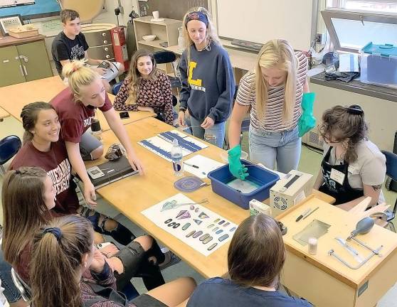 Lauren Eckert of Peter's Valley School of Craft, shares her jewelry making skills with students at Kittatinny Regional High School